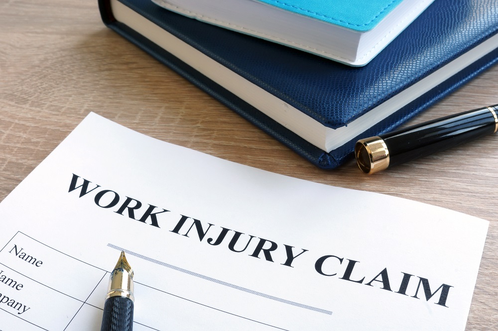 Work injury claim form and note pad.